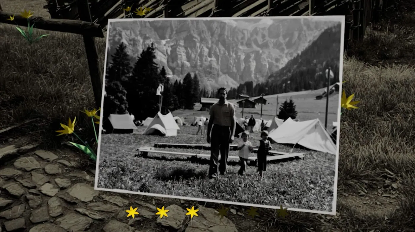 Ein mit KI animiertes schwarz/weiss Foto aus der AR-Anwendung, das ein altes Pfadilager in Adelboden zeigt